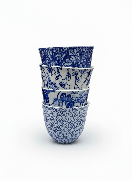  A suprise selction  of four blue and white printy printed teacups  